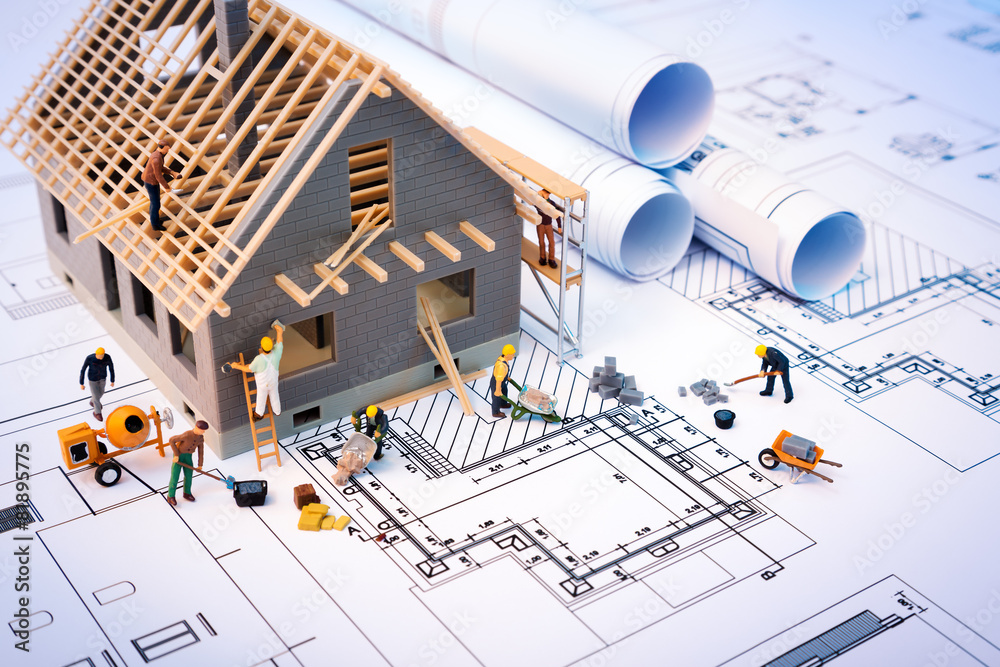 Construction blueprint with tools, symbolizing GTS Construction's approach
